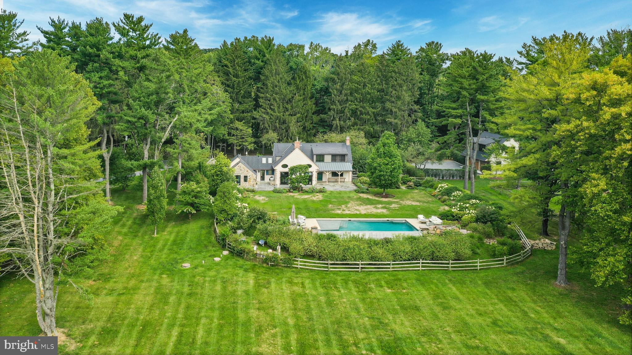 7043 Phillips Mill Road New Hope, PA 18938 - Photo 83 of 84 a swimming pool with outdoor seating and trees