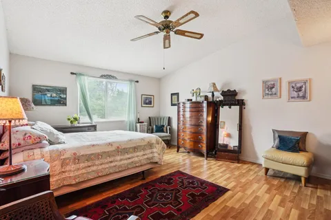 a bedroom with a bed and a couch