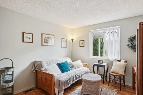 a living room with furniture and windows