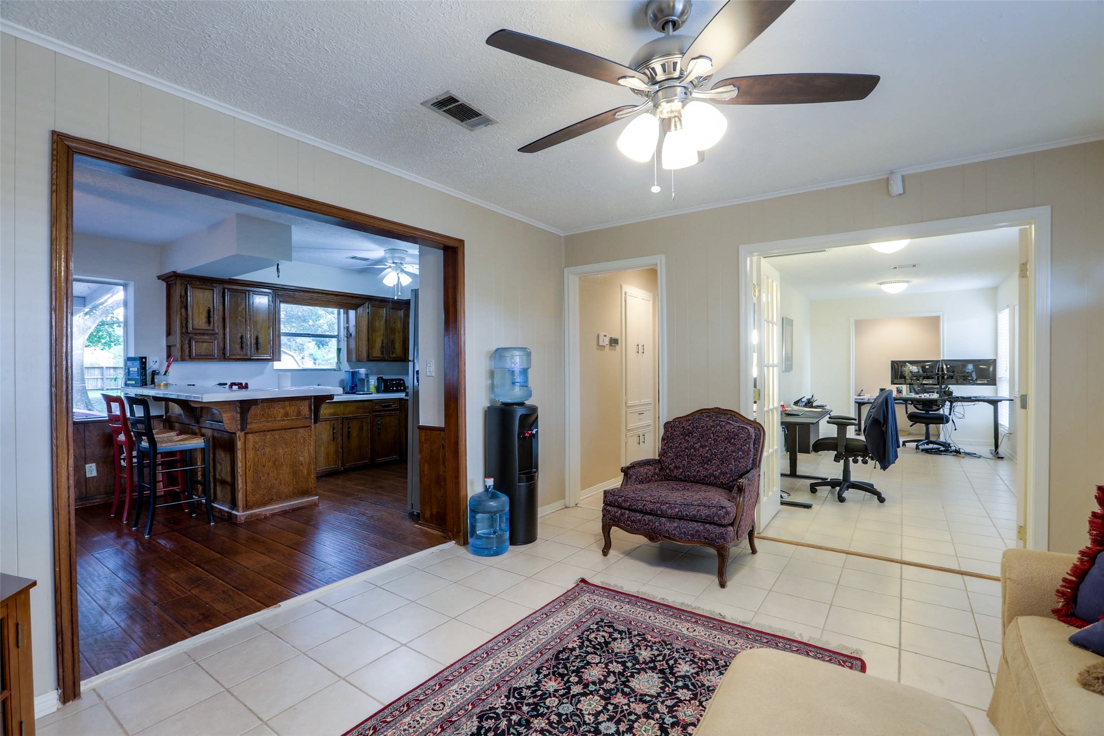 12810 Mcswain Road Cypress, TX 77429 - Photo 11 of 17 a living room with furniture and a dining table with wooden floor