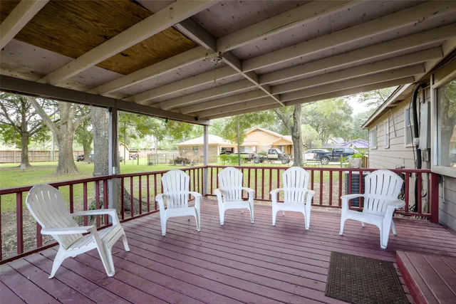 a view of balcony with wooden floor