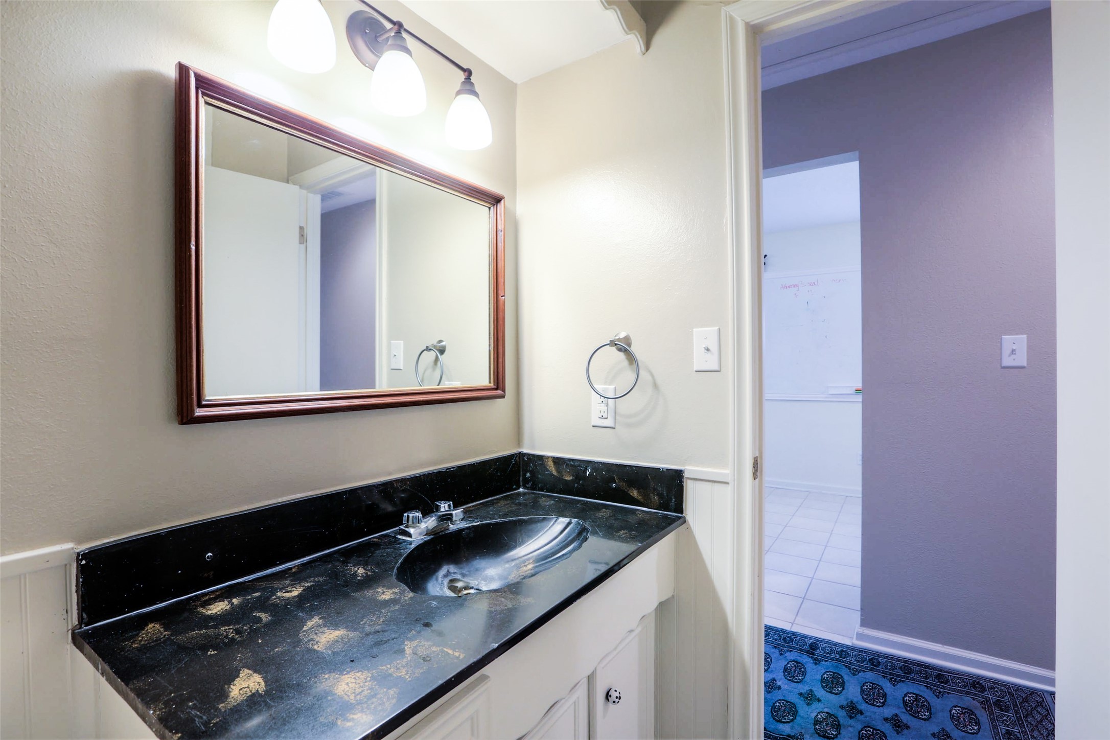 12810 Mcswain Road Cypress, TX 77429 - Photo 7 of 17 a bathroom with a sink and a mirror