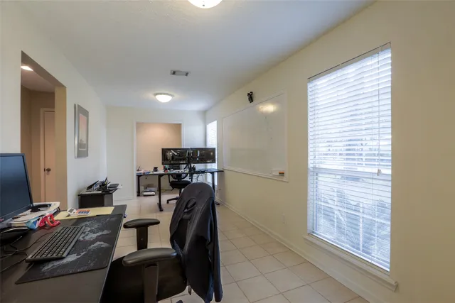 a workspace with furniture and a window