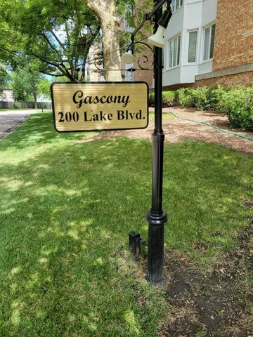 a street sign that is sitting in the grass
