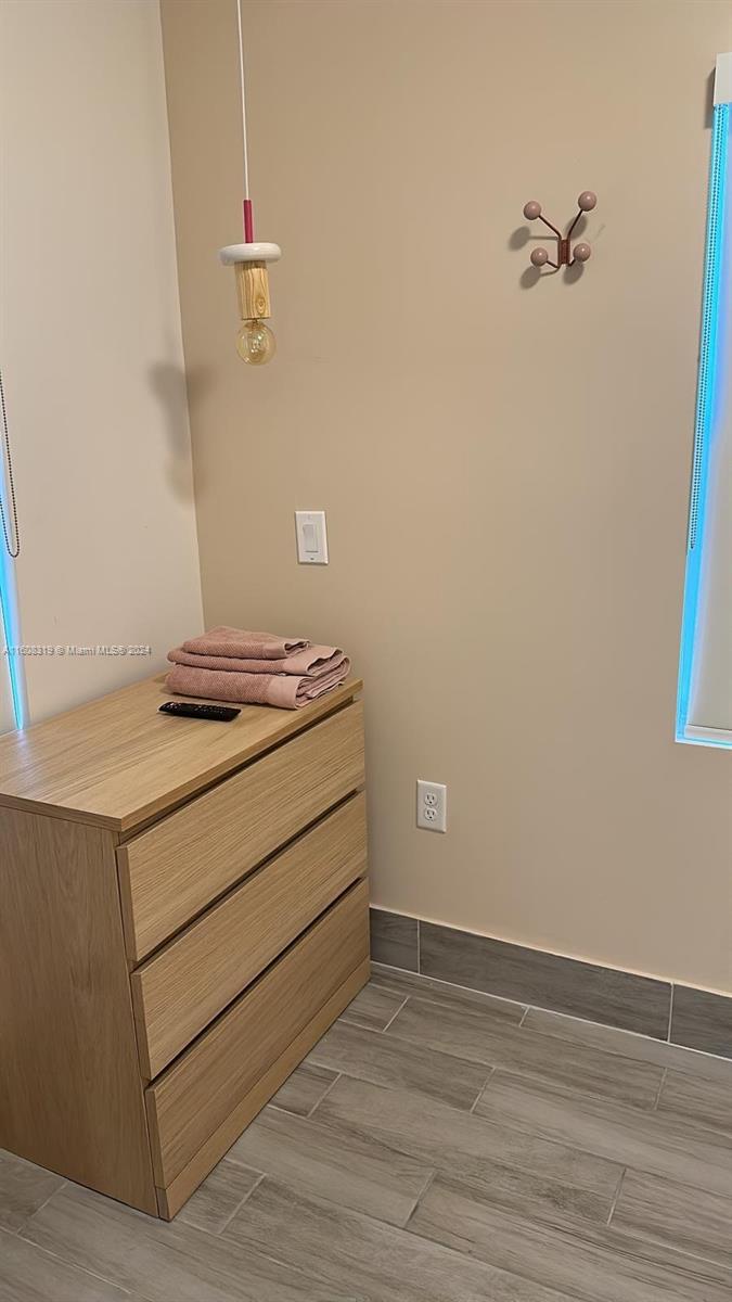 671 Northwest 50th Street, Unit 2 Miami, FL 33127 - Photo 12 of 14 a room with a dresser and a window