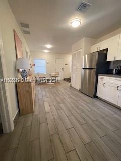 671 Northwest 50th Street, Unit 2 Miami, FL 33127 - Photo 13 of 14 a view of a refrigerator in kitchen and a sink