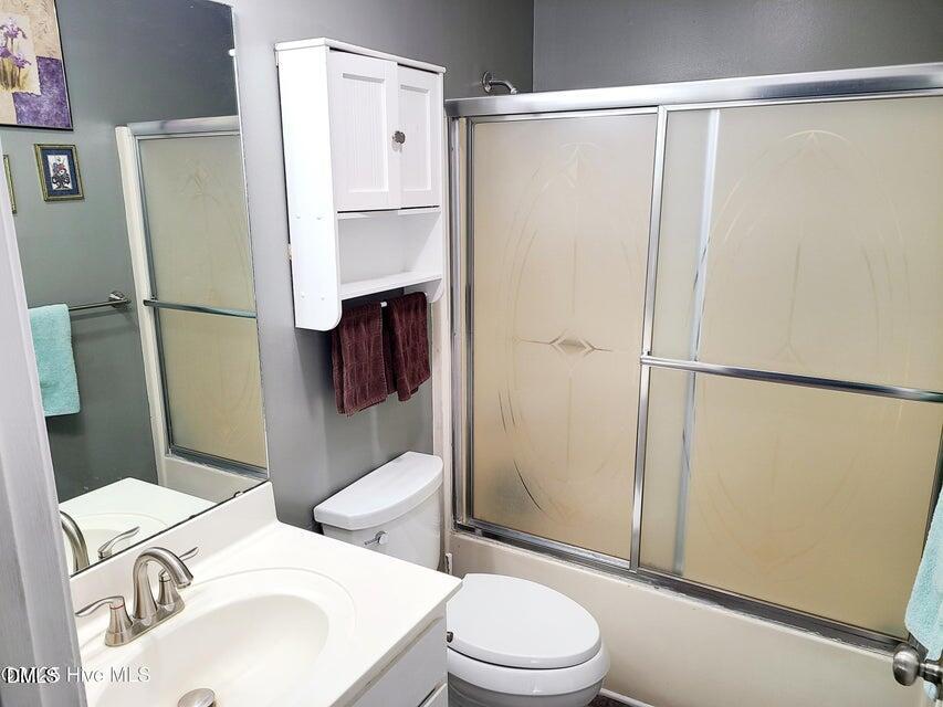 1000 High House Road Clinton, NC 28328 - Photo 13 of 36 a white toilet sitting next to a bathroom sink