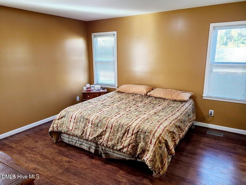 1000 High House Road Clinton, NC 28328 - Photo 14 of 36 a large bed sitting in a bedroom next to a window