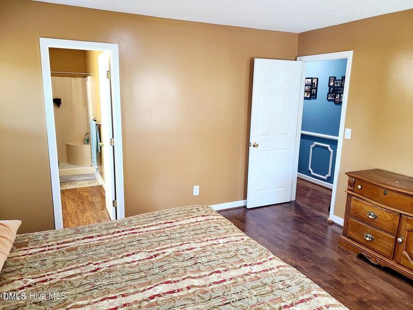 1000 High House Road Clinton, NC 28328 - Photo 15 of 36 a bedroom with a bed and wooden floor