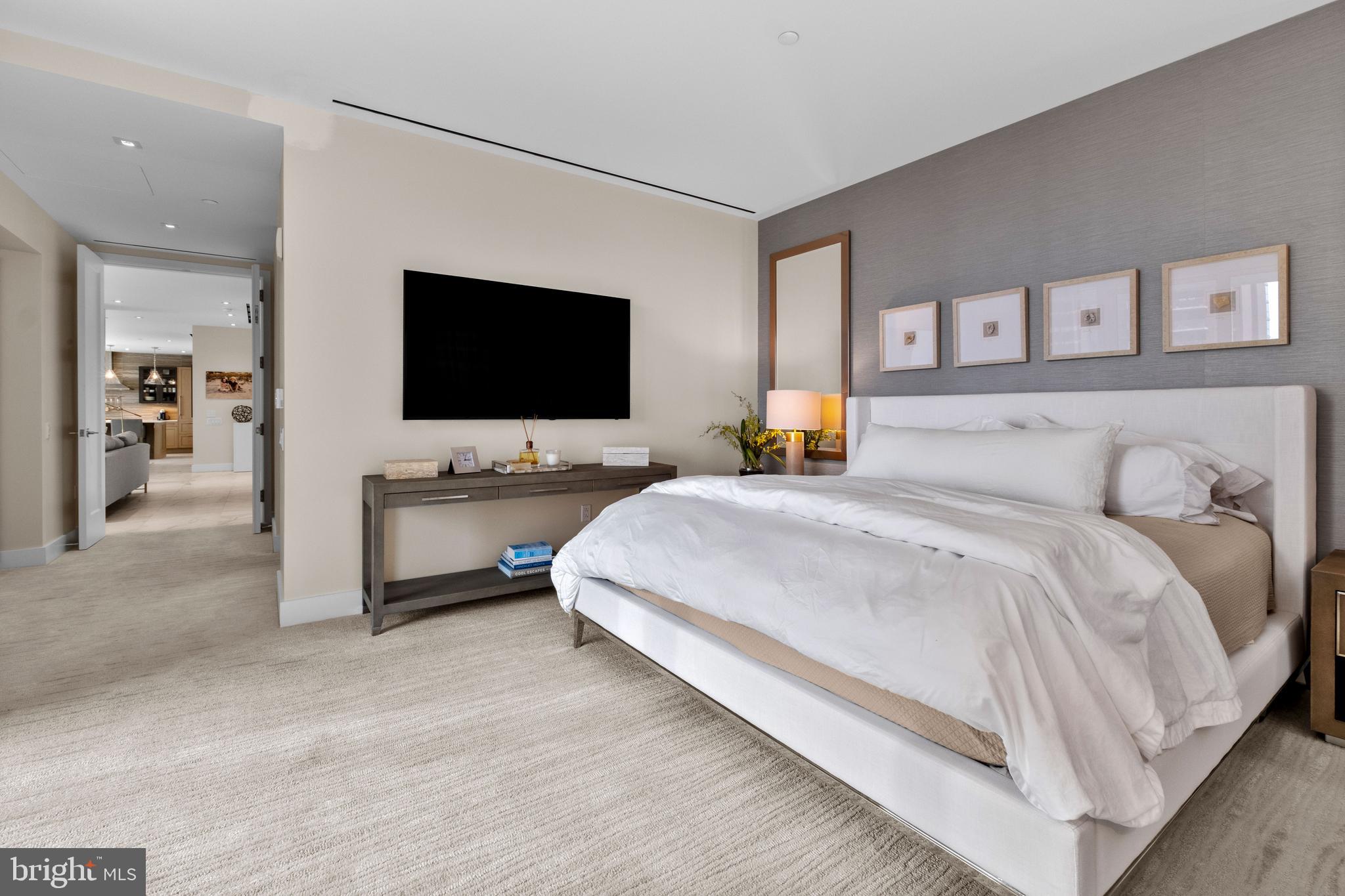 500 Walnut Street, Unit 1001 Philadelphia, PA 19106 - Photo 29 of 60 a bedroom with a bed and a flat screen tv