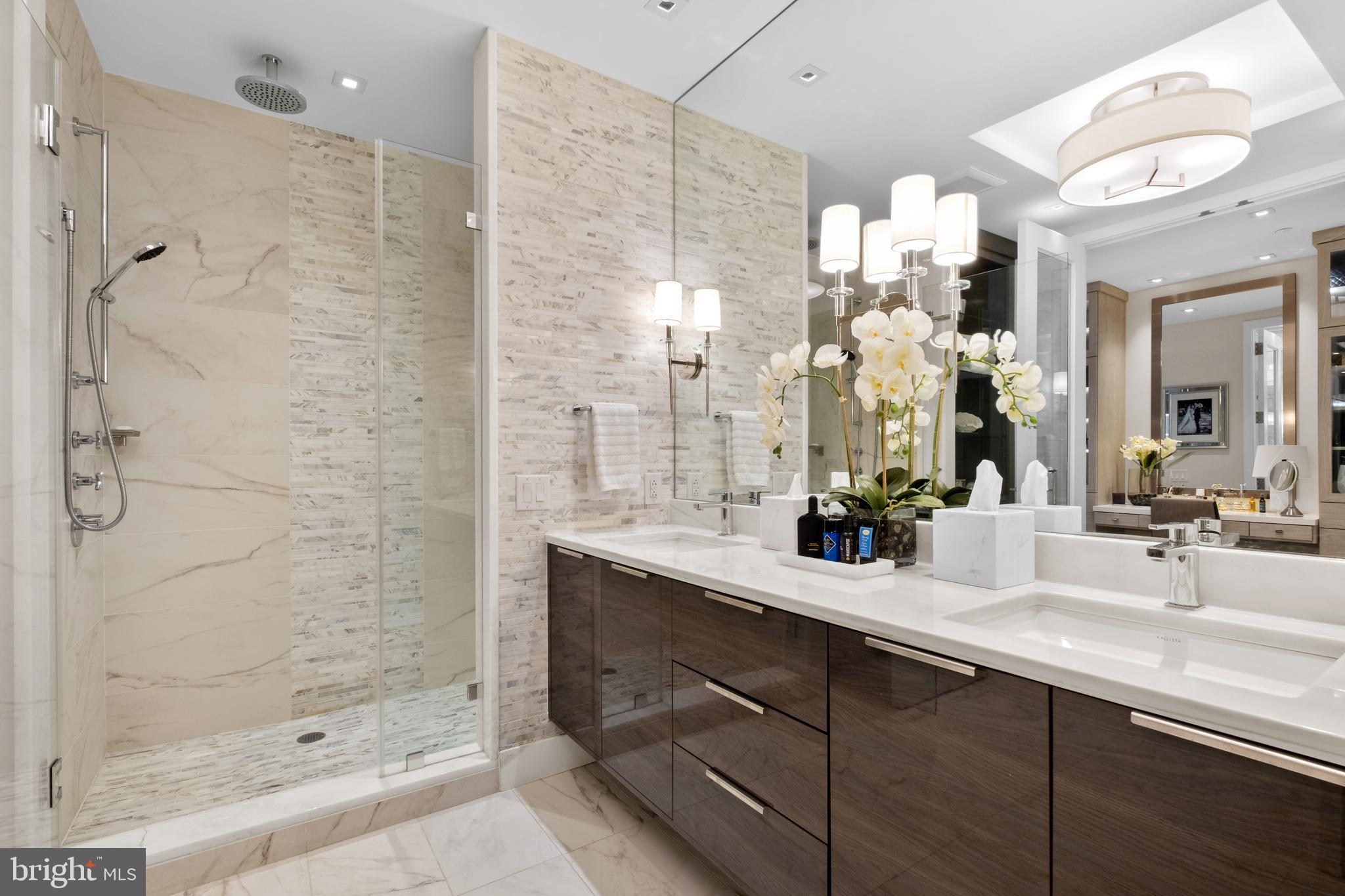 500 Walnut Street, Unit 1001 Philadelphia, PA 19106 - Photo 39 of 60 a bathroom with a double vanity sink mirror and shower
