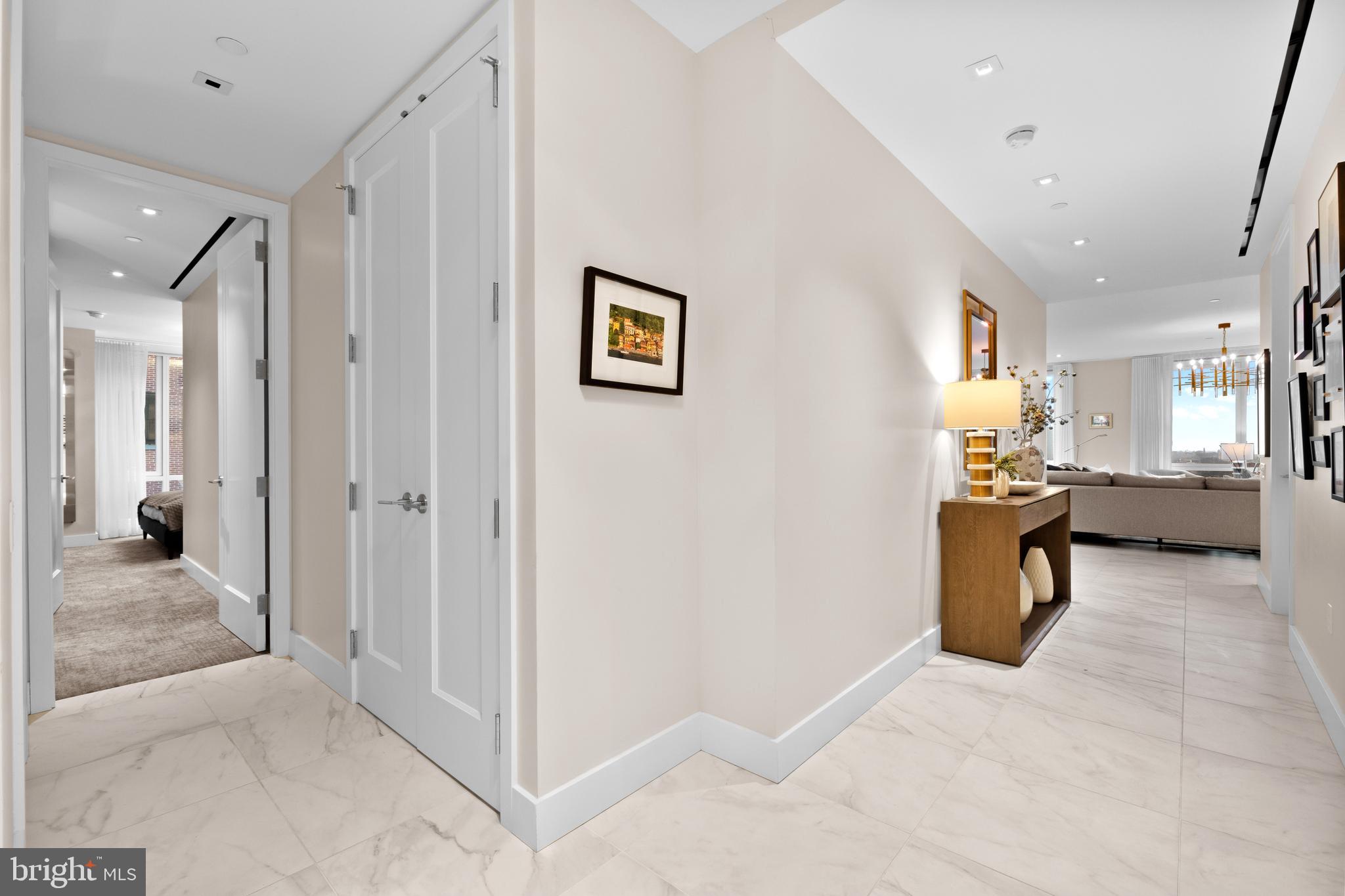 500 Walnut Street, Unit 1001 Philadelphia, PA 19106 - Photo 46 of 60 a view of a hallway with dining area and chandelier