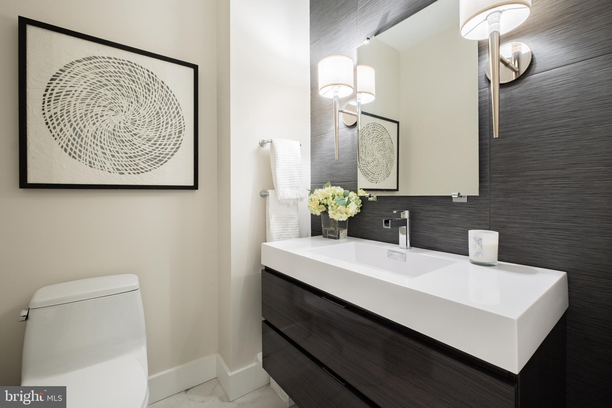 500 Walnut Street, Unit 1001 Philadelphia, PA 19106 - Photo 47 of 60 a bathroom with a sink vanity and a toilet