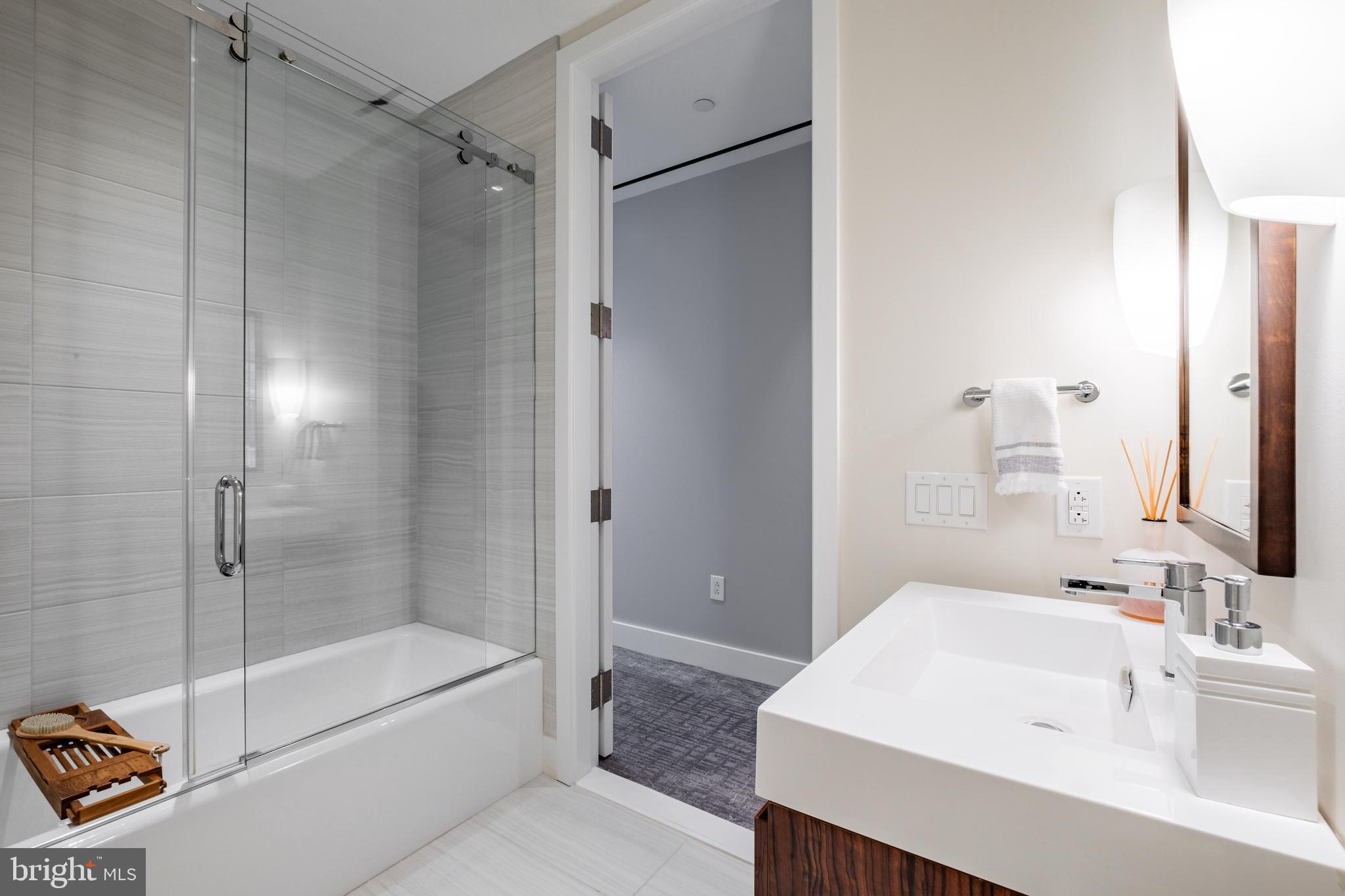 500 Walnut Street, Unit 1001 Philadelphia, PA 19106 - Photo 49 of 60 a bathroom with a bathtub shower sink and toilet
