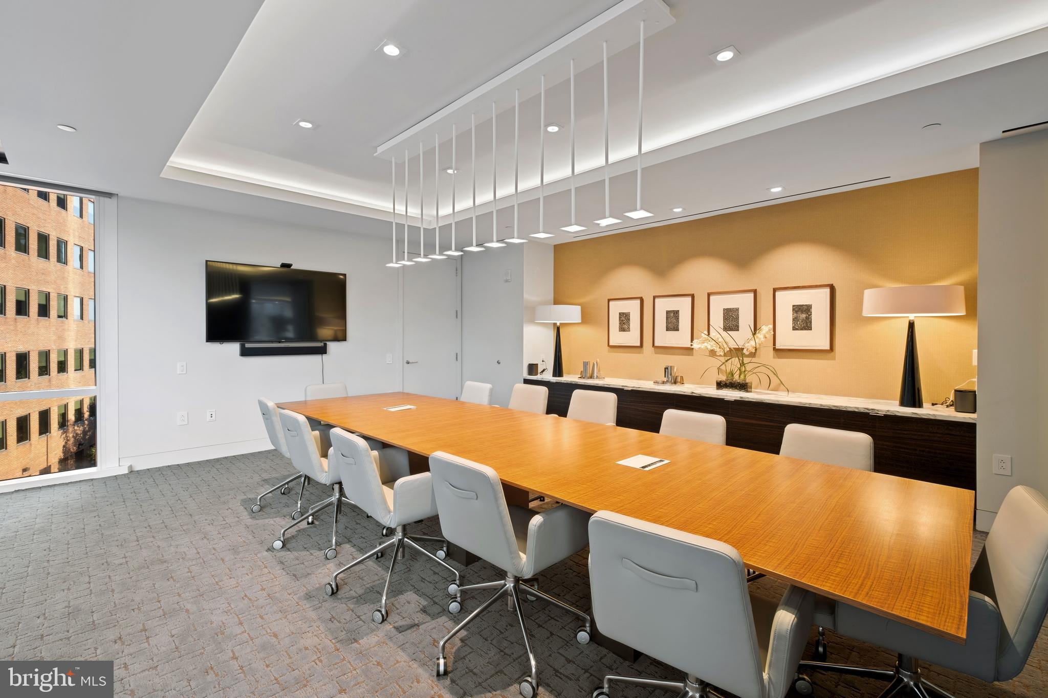 500 Walnut Street, Unit 1001 Philadelphia, PA 19106 - Photo 56 of 60 a dining room with furniture and a flat screen tv