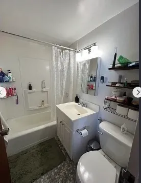 a bathroom with a sink a toilet and bathtub