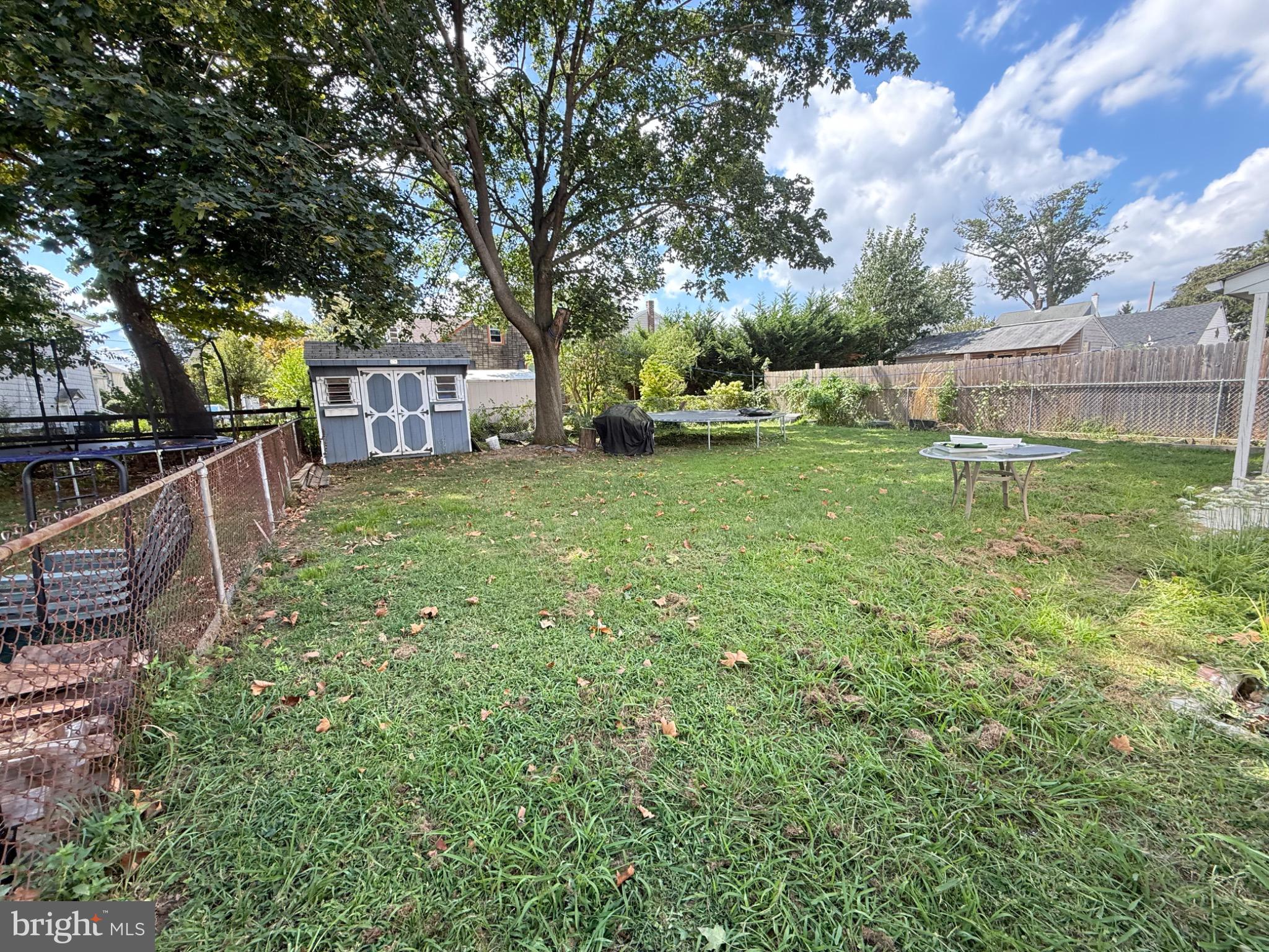 214 Pine Road Wallingford, PA 19086 - Photo 13 of 17 Spacious backyard with lush greenery.