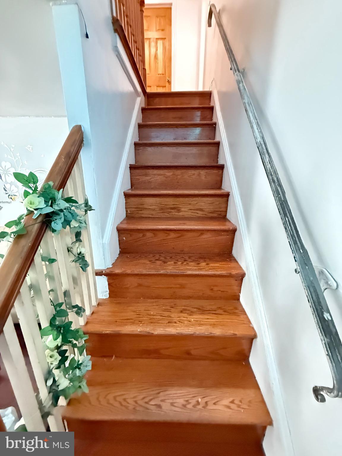 214 Pine Road Wallingford, PA 19086 - Photo 5 of 17 Inviting staircase with warm wooden tones.