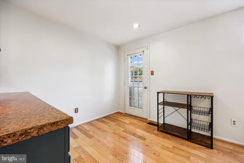 a bedroom with a granite countertop sink and cabinets