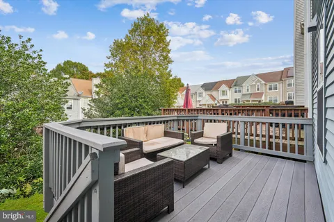a view of balcony with furniture