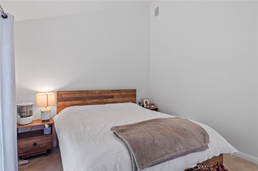 25902 Vía Del Sur Mission Viejo, CA 92691 - Photo 17 of 30 a bedroom with a bed and a night stand