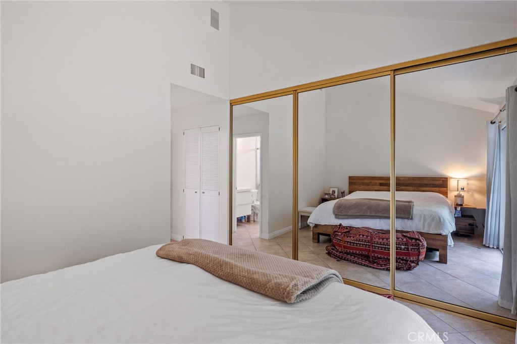 25902 Vía Del Sur Mission Viejo, CA 92691 - Photo 18 of 30 a bedroom with a bed and a mirror