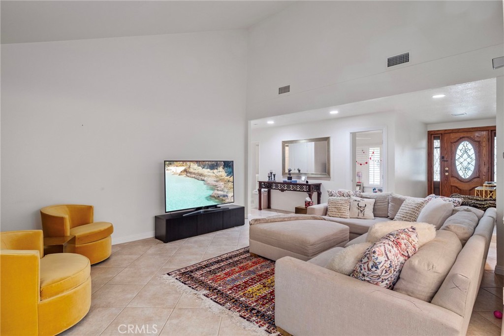 25902 Vía Del Sur Mission Viejo, CA 92691 - Photo 2 of 30 a living room with furniture and a flat screen tv