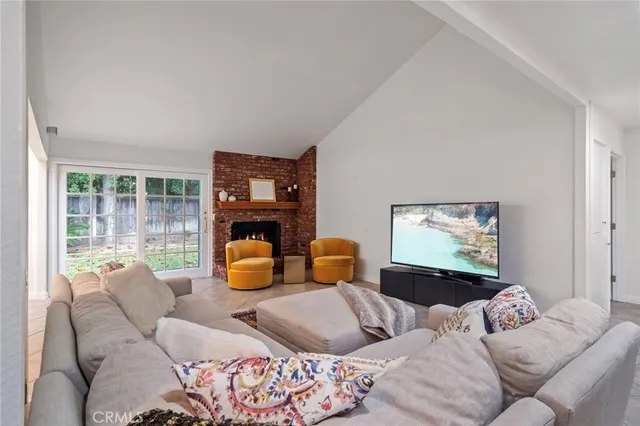 a bedroom with furniture and a lamp