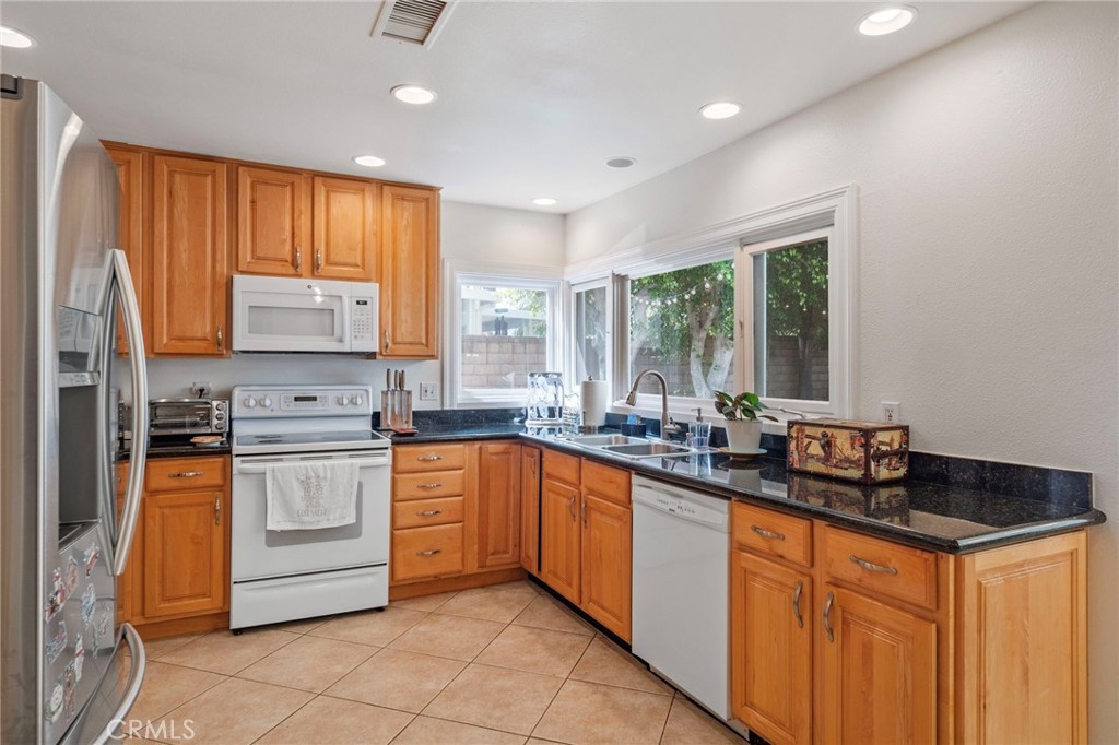 25902 Vía Del Sur Mission Viejo, CA 92691 - Photo 6 of 30 a kitchen with stainless steel appliances a sink stove and cabinets