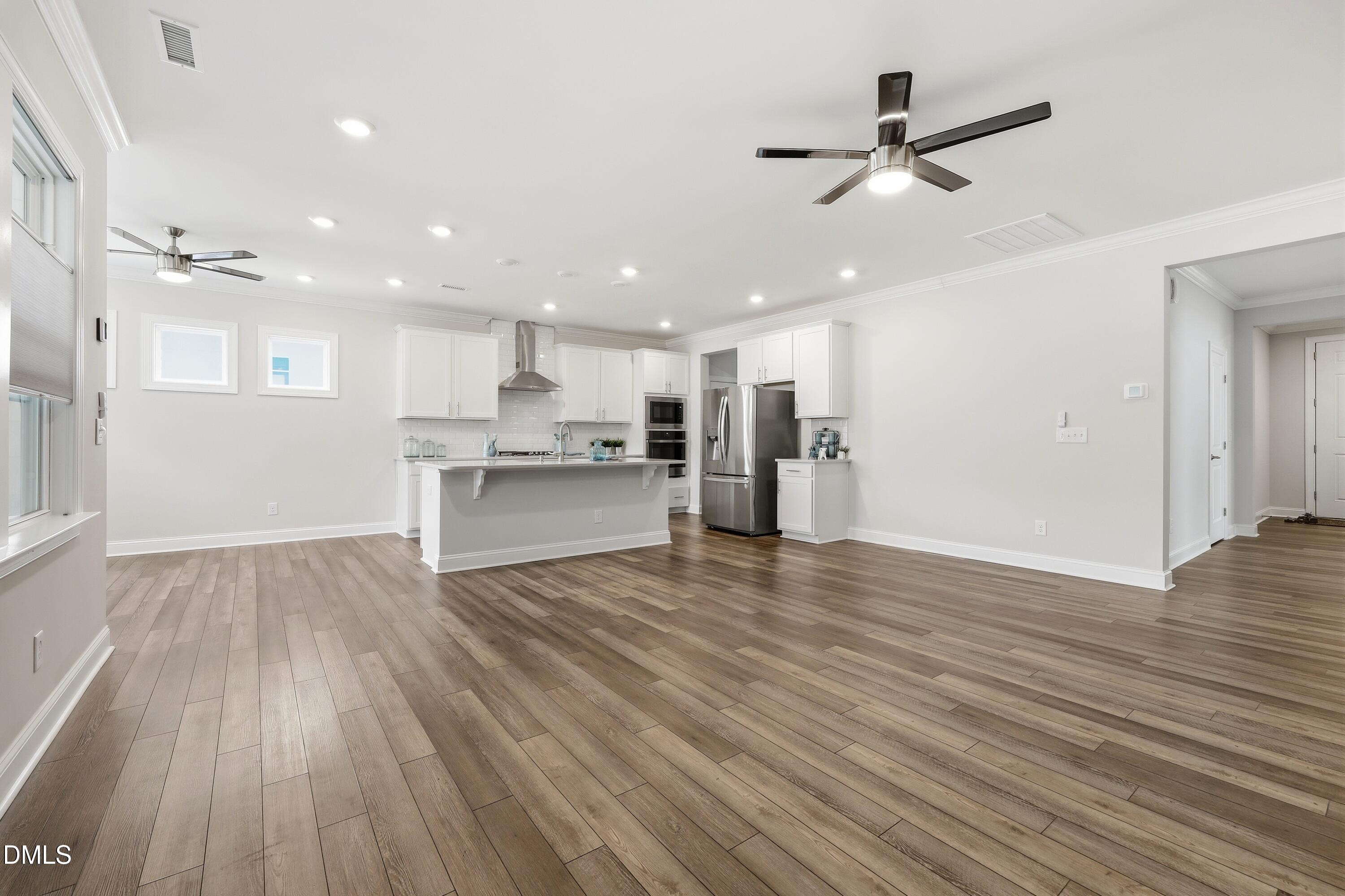 289 English Violet Lane Raleigh, NC 27610 - Photo 39 of 40 a view of a kitchen with a wooden floor and a kitchen view