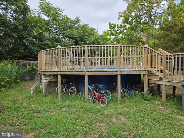 a view of a chair and table on the garden