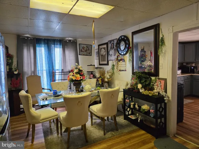 a view of a dining room with furniture and window