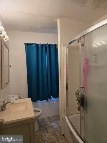 a bathroom with a sink and a shower