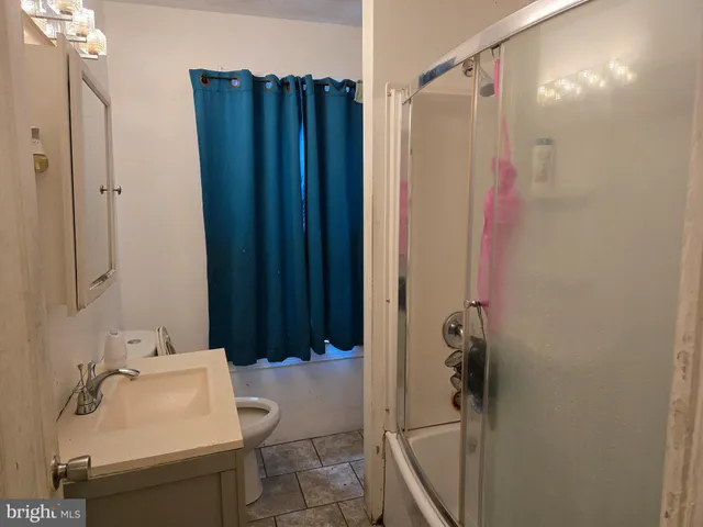 a bathroom with a sink and shower