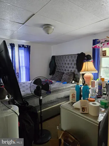 a kitchen with a stove and a dining table