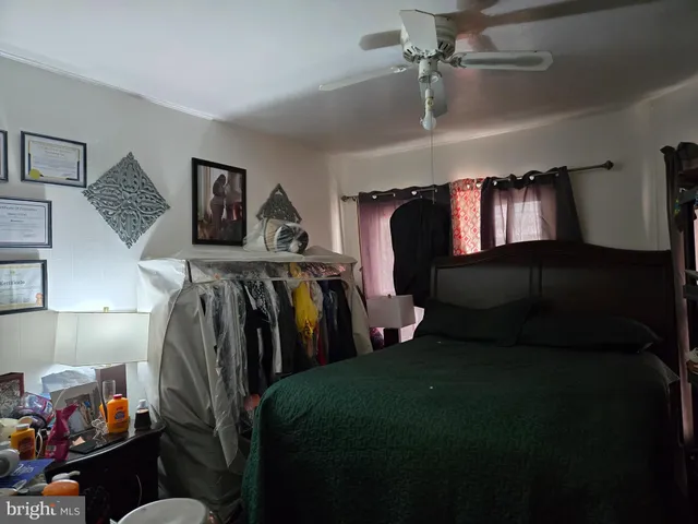 a bedroom with a bed and closet