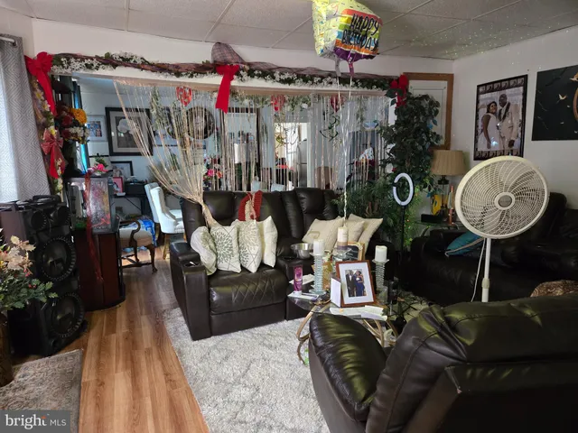 a living room filled with furniture and a window