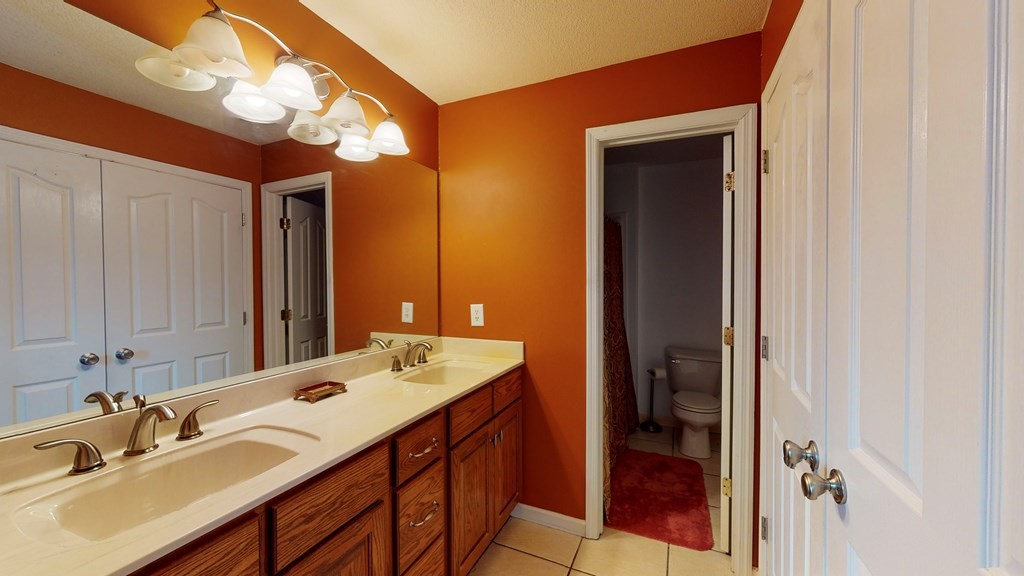 1365 No Pone Valley Road Northwest Georgetown, TN 37336 - Photo 22 of 48 a bathroom with a double vanity sink and a mirror