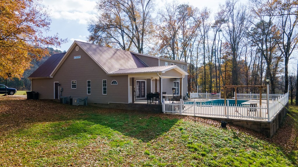 1365 No Pone Valley Road Northwest Georgetown, TN 37336 - Photo 36 of 48 a view of a house with a yard patio and sitting area