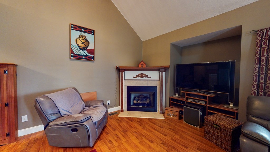 1365 No Pone Valley Road Northwest Georgetown, TN 37336 - Photo 4 of 48 a living room with furniture a flat screen tv and a fireplace