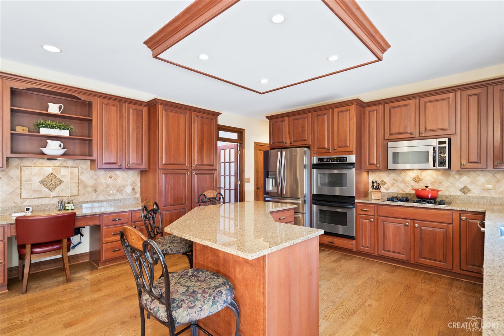 3519 Vanilla Grass Drive Naperville, IL 60564 - Photo 4 of 48 a kitchen with refrigerator a stove and chairs