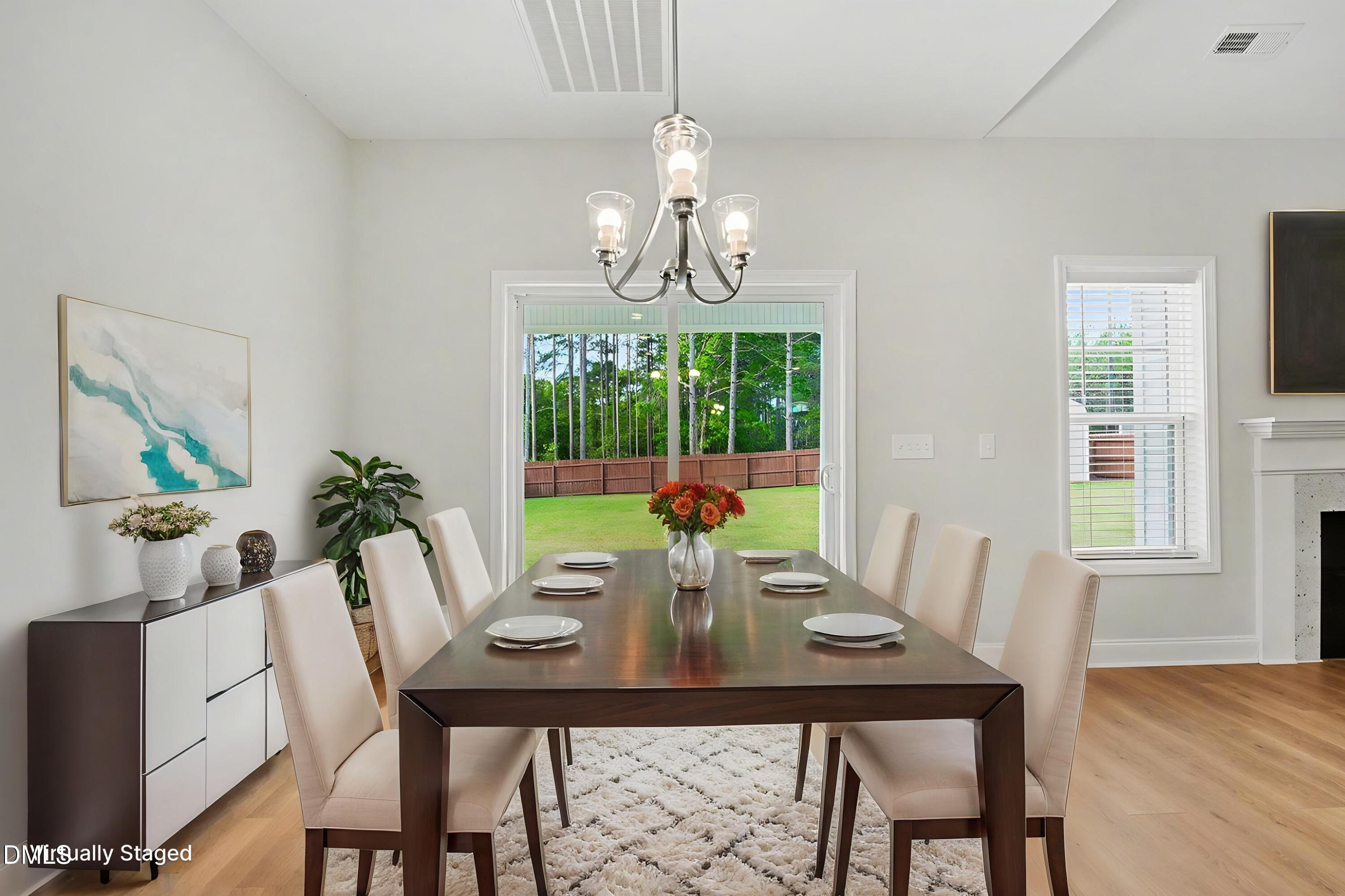 2815 Lemuel Black Road Spring Lake, NC 28390 - Photo 4 of 37 a view of a dining room with furniture a chandelier and wooden floor