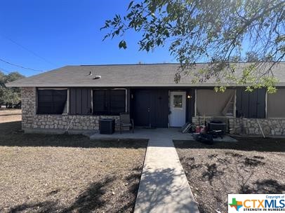 200 Olsens Acres, Unit D6 Wimberley, TX 78676 - Photo 12 of 21 a front view of a house with a yard and a couch
