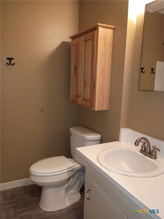 200 Olsens Acres, Unit D6 Wimberley, TX 78676 - Photo 4 of 21 a bathroom with a sink a toilet and mirror