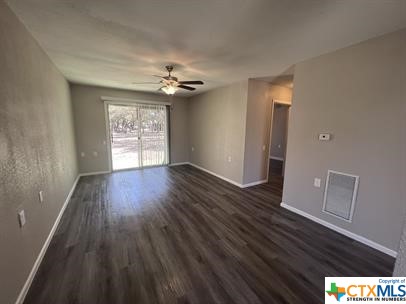 200 Olsens Acres, Unit D6 Wimberley, TX 78676 - Photo 7 of 21 a view of an empty room with a window and wooden floor