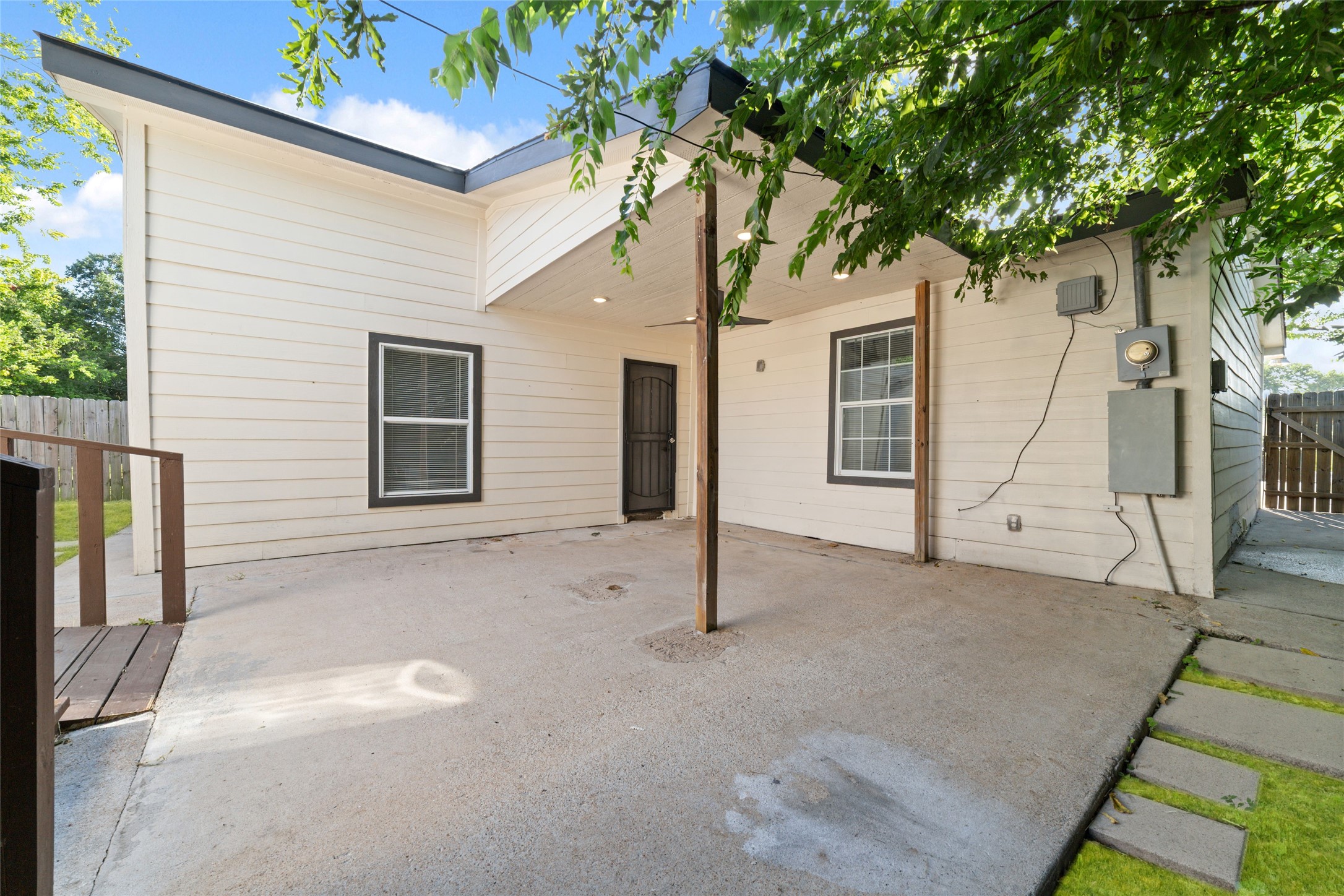 7125 Conley Street Houston, TX 77021 - Photo 17 of 32 Stepping outside into the covered backyard patio with two additional dwellings (each with HVAC).