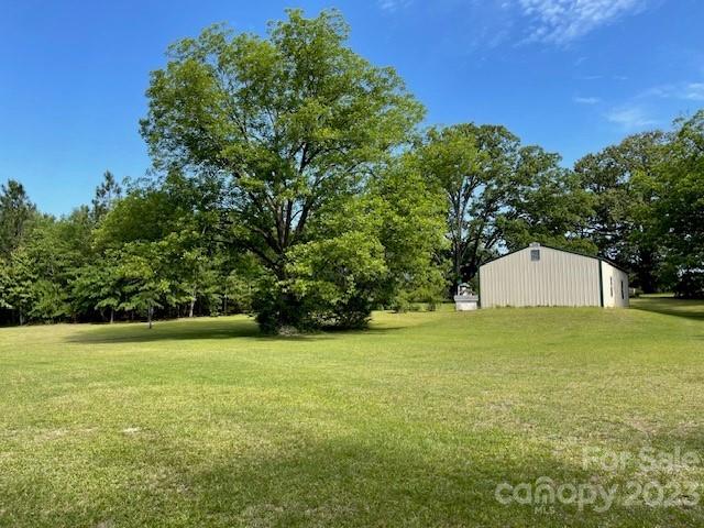 149 Robert Joyner Circle Salley, SC 29137 - Photo 11 of 48 a view of a big yard with a house in the background
