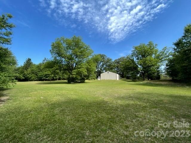 149 Robert Joyner Circle Salley, SC 29137 - Photo 12 of 48 a view of a field of grass and trees