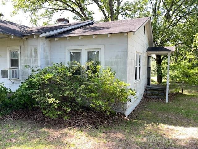 149 Robert Joyner Circle Salley, SC 29137 - Photo 18 of 48 a view of a house with a yard plants and large tree