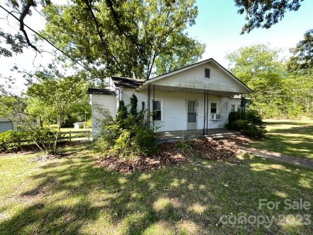 149 Robert Joyner Circle Salley, SC 29137 - Photo 2 of 48 a backyard of a house with plants and tree